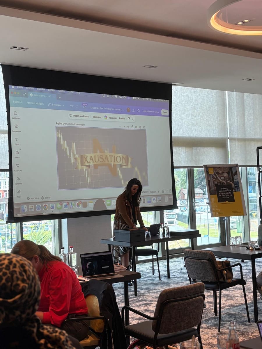 Presenter working through a chart at the front of the room, attendees seated in the foreground.